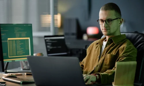 male-computer-programmer-coding-on-laptop-sitting-2026-01-09-01-06-51-utc.webp